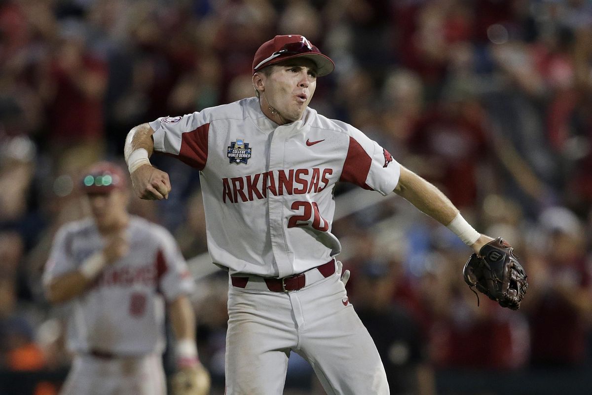 Arkansas second baseman Carson Shaddy celebrates after tagging out Oregon State’s Zak Taylor trying to advance on a base hit during the seventh inning of Game 1 of the NCAA College World Series baseball finals in Omaha, Neb., Tuesday, June 26, 2018. Arkansas won 4-1. (Nati Harnik / Associated Press)
