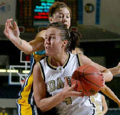 
Idaho's Emily Faurholt, who scored 21 points, drives around Irvine's Ashley Biggins during the first half of their Big West tournament game.
 (Associated Press / The Spokesman-Review)