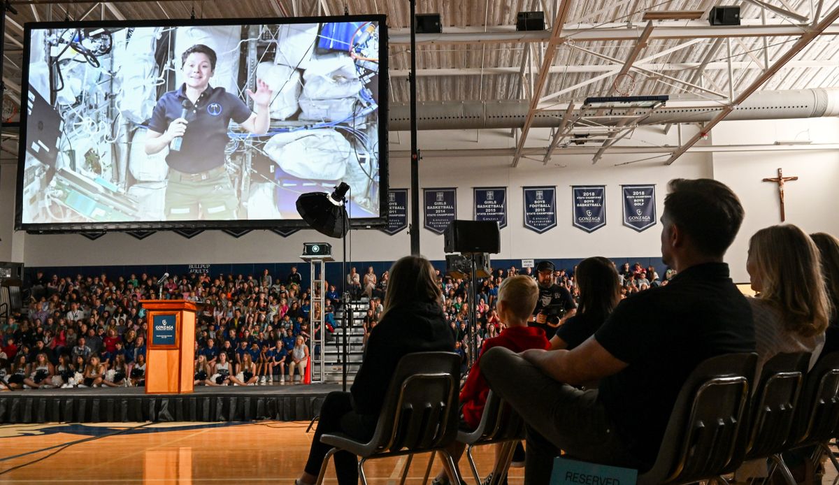 NASA astronaut Anne McClain speaks from the International Space Station to hundreds of kids at an assembly Tuesday at Gonzaga Prep. (Jesse Tinsley/The Spokesman-Review)