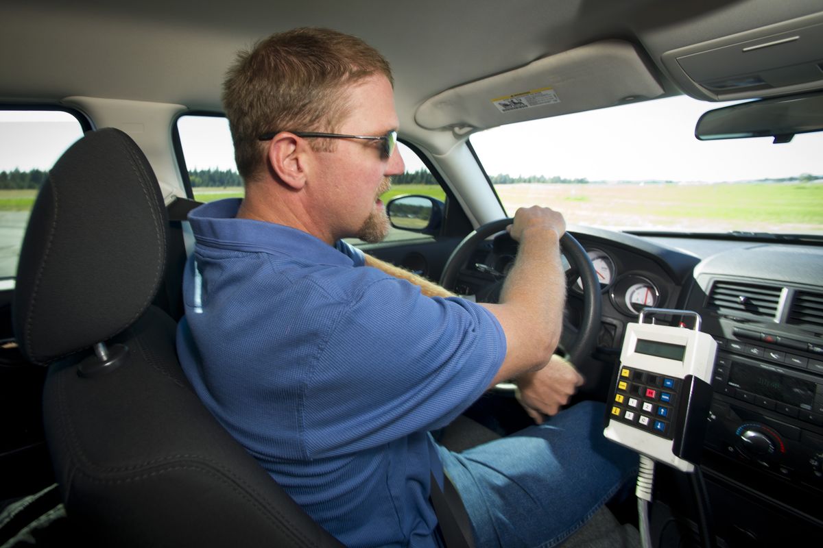 John Foster, of the Spokane County Risk Management Department, demonstrates how not to steer in slick conditions last month at the Deer Park Airport. He was driving a SkidCar, which uses extra wheels and hydraulics to replicate the effects of icy roads. (Colin Mulvany)