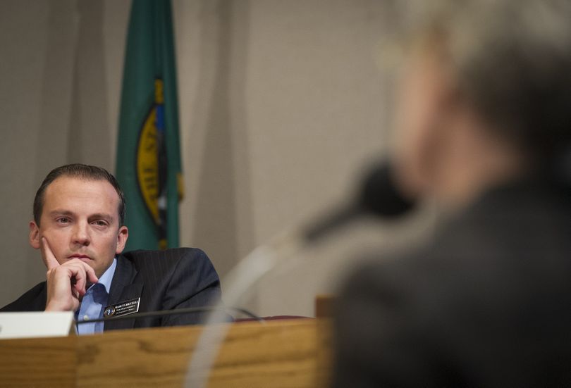 State Rep. Marcus Riccelli, D-Spokane, listens to public testimony from Katie Evans on Tuesday during a public hearing at Spokane City Hall concerning the safety of the transportation of bulk crude oil by railroad. (Colin Mulvany)