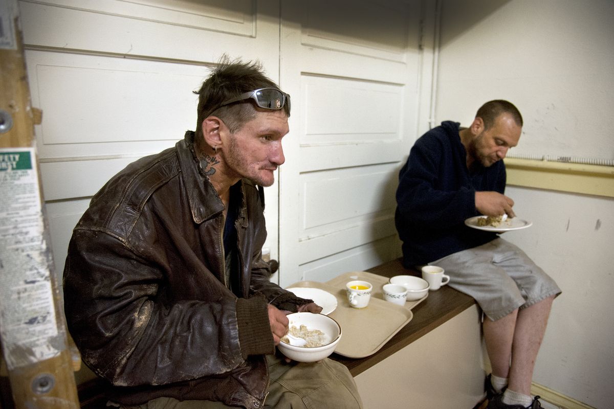 Joe Frear, left, and John Warren enjoy breakfast at the Central United Methodist Church. The church is investing $100,000 to launch a five-tiered program, called “Change for the Better,” to help the homeless in conjunction with Shalom Ministries. (Dan Pelle)
