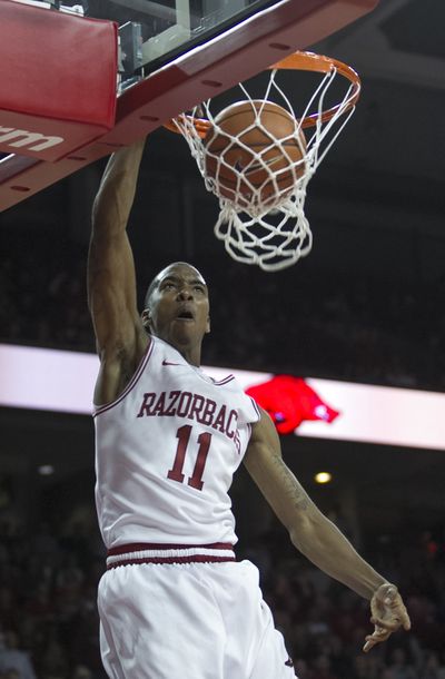 Arkansas’ BJ Young dunks in upset win over No. 2 Florida. (Associated Press)