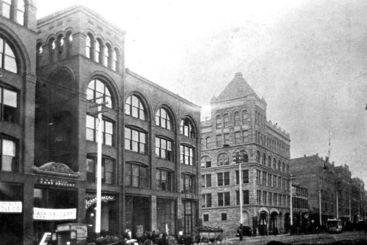 The stately peaked roof of the Granite Block is seen on the southwest corner of Stevens Street and Riverside Avenue around 1900. (Photo courtesy of the Spokane Public / COURTESY PHOTO)