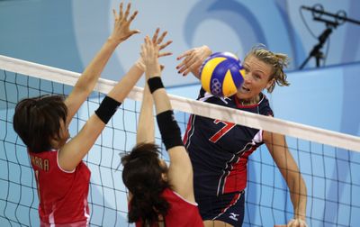 Associated Press Heather Bown of the U.S. spikes a ball against Japan’s Megumi Kurihara, left, and Erika Araki. (Associated Press / The Spokesman-Review)