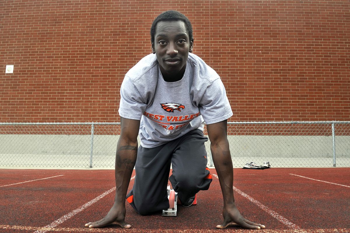 West Valley High senior sprinter-jumper Terrynce Duke poses in the blocks Wednesday at the school, where he has racked up many team points for Eagles track. (Jesse Tinsley)