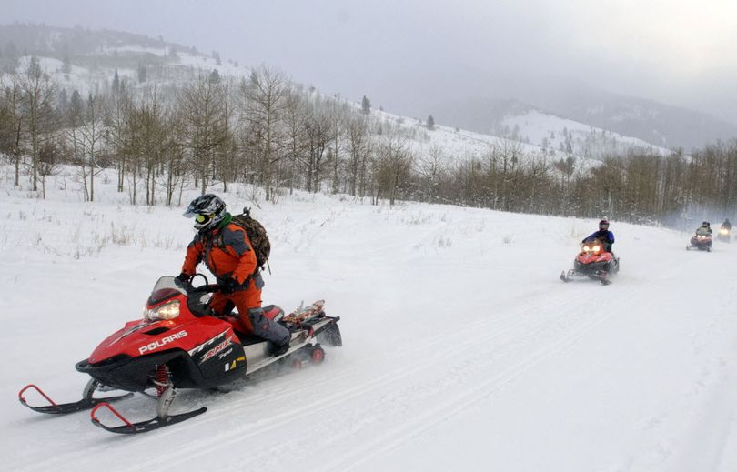 Members of the Cache County Search and Rescue team go up Franklin Basin, in Logan Canyon, Utah, looking for a lost snowmobiler, Monday, Dec. 29, 2014. Lawrence Orduno got stranded while snowmobiling in the area late Saturday night and survived two nights in the backcountry before being found alive.  (Associated Press)