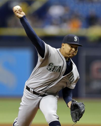 Seattle Mariners starting pitcher Taijuan Walker delivers to the Tampa Bay Rays during the first inning on Tuesday in St. Petersburg, Florida. Walker left the game early with an inflamed tendon. (Chris O'Meara / Associated Press)