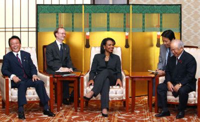 
U.S. Secretary of State Condoleezza Rice, center, shares a light moment with Japanese defense chief Fumio Kyuma, right, and Foreign Minister Taro Aso, left, in Tokyo on Wednesday. Rice urged the swift and effective implementation of U.N. sanctions against North Korea.
 (Associated Press / The Spokesman-Review)