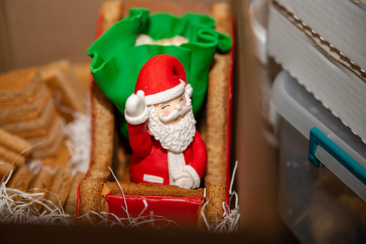 Sweet Frostings' fondant Santa waits to be unboxed and placed with an entry at the Davenport Grand on Dec. 9, 2018. The event featured family gingerbread building, photos with a life-sized gingerbread man and woman, and professional competitors. (Libby Kamrowski / The Spokesman-Review)
