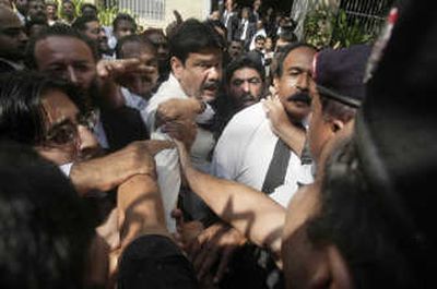 
Lawyers scuffle with police Monday  in Karachi, Pakistan. Associated Press
 (Associated Press / The Spokesman-Review)