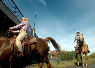 
Peter Goldmark and his daughter Jennette pause before crossing under the Trent Avenue bridge on their way to Goldmark's campaign kickoff rally Wednesday.
 (Joe Barrentine / The Spokesman-Review)