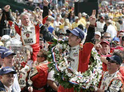 
Dan Wheldon of Great Britain celebrates in Victory Circle after winning the 89th running of the Indianapolis 500 on Sunday at Indianapolis Motor Speedway.
 (Associated Press / The Spokesman-Review)