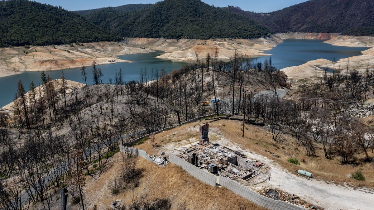 A home destroyed in the 2020 North Complex Fire sits above Lake Oroville on Sunday, May 23, 2021, in Oroville, Calif. At the time of this photo, the reservoir was at 39 percent of capacity and 46 percent of its historical average. California officials say the drought gripping the U.S. West is so severe it could cause one of the state