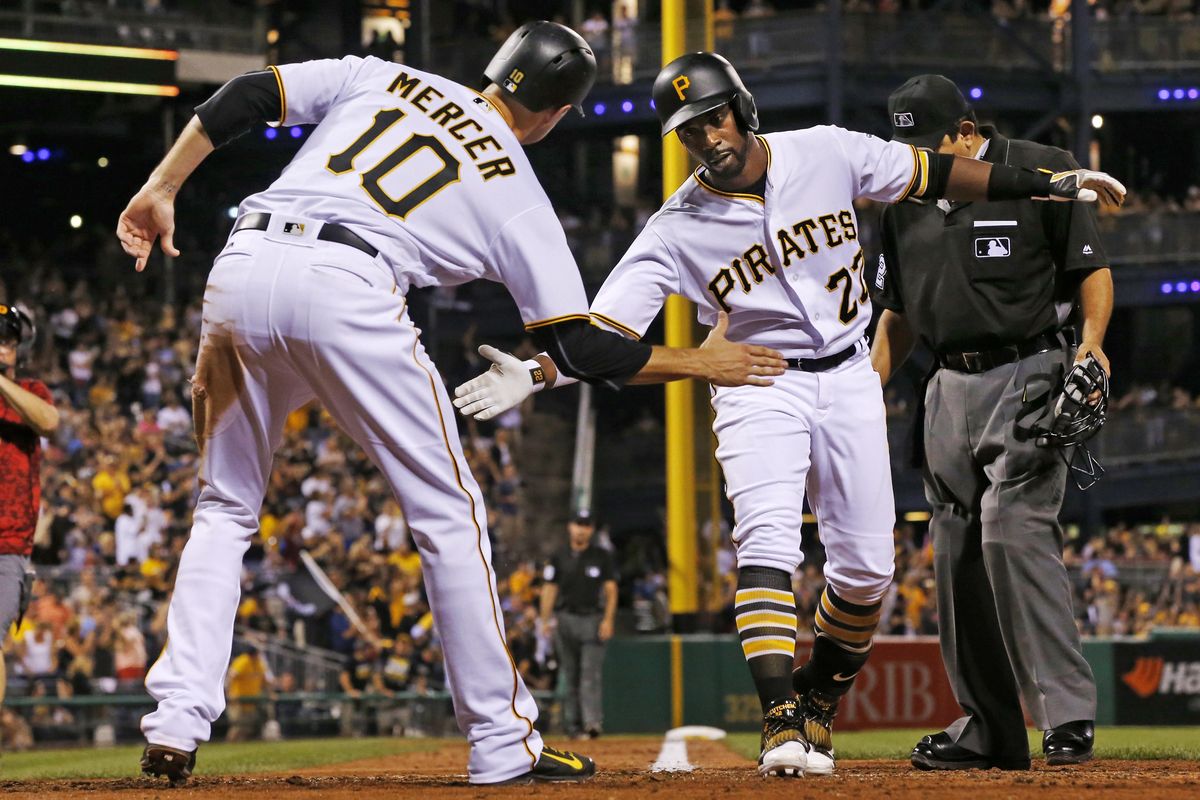 Pittsburgh’s Andrew McCutchen, right, celebrates with Jordy Mercer after hitting a three-run home run off Seattle Mariners relief pitcher David Rollins during the eighth inning Wednesday. (Gene J. Puskar / Associated Press)