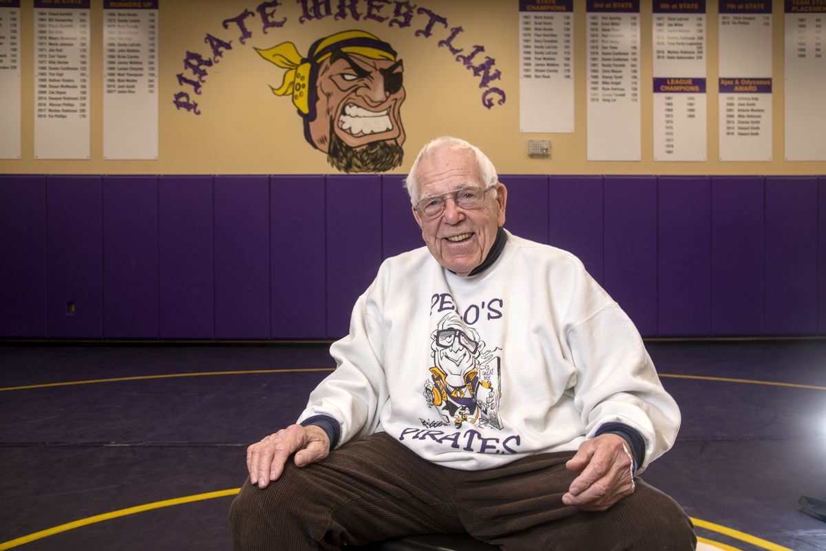 Ken Pelo, who coached wrestling at Rogers High School for 37 years, posed for a picture Wednesday in the wrestling room at Rogers on the night he was inducted to the school’s “Walk of Fame.”  (Jesse Tinsley/THE SPOKESMAN-REVI)