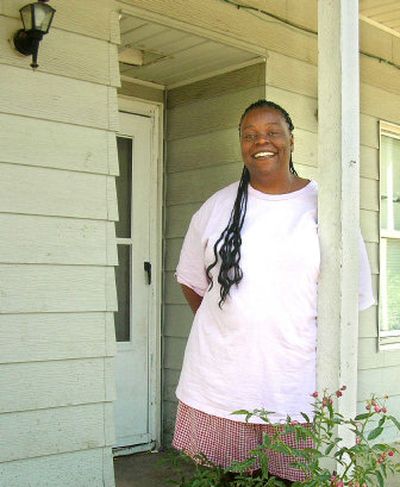 
Katreena Ann Rogers poses in front of her house on Spokane's North Side. 
 (Jamie Tobias Neely / The Spokesman-Review)