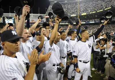 New York players salute the fans after beating Baltimore.  (Associated Press / The Spokesman-Review)