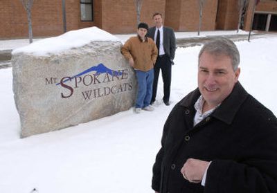
Dave Nelson of Land Expressions has contributed more than the rock to Mt Spokane High School. He has donated his efforts to work with students, offering them job skills and on-the-job-training. At rear is student Mile Henderson and Mt. Spokane Assistant Principal Jim Preston. 
 (Dan Pelle / The Spokesman-Review)