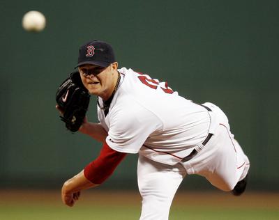 Jon Lester matched his season high with nine strikeouts in 72/3 innings for Boston. (Associated Press / The Spokesman-Review)