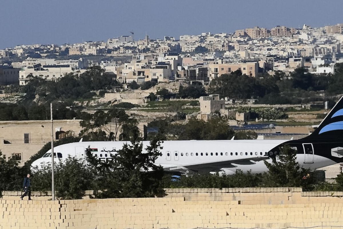 An Afriqiyah Airways plane from Libya stands on the tarmac at Malta
