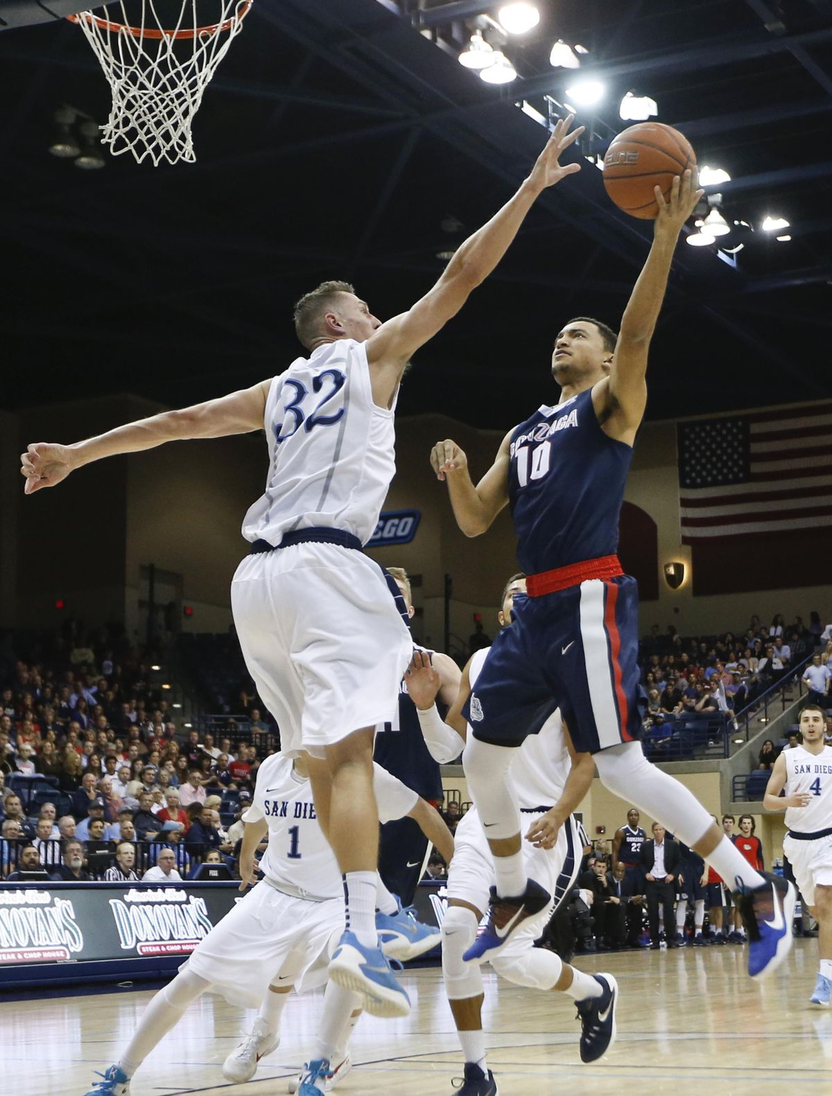Gonzaga guard Bryan Alberts puts a shot up over the defense of San Diego forward Brett Bailey during the first half of an NCAA college basketball game Thursday, Feb. 25, 2016, in San Diego. (Lenny Ignelzi / Associated Press)