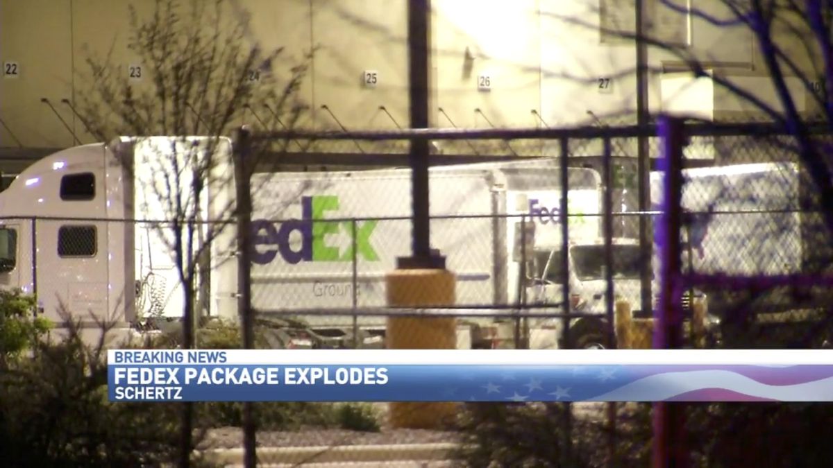 In this frame from video, Fedex trucks line a distribution center where a package bomb exploded early, Tuesday, March 20, 2018, in Schertz, Texas. Authorities believe the explosion is linked to the recent string of Austin bombings. (WOAI San Antonio via AP) ORG XMIT: TXTV201 (AP)