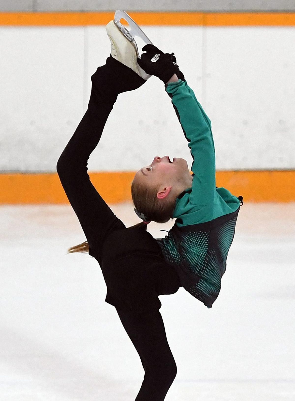 Emma Dickau, the daughter of former Gonzaga great Dan Dickau, has put in the work to become an accomplished skater at the age of 10. (Colin Mulvany / The Spokesman-Review)
