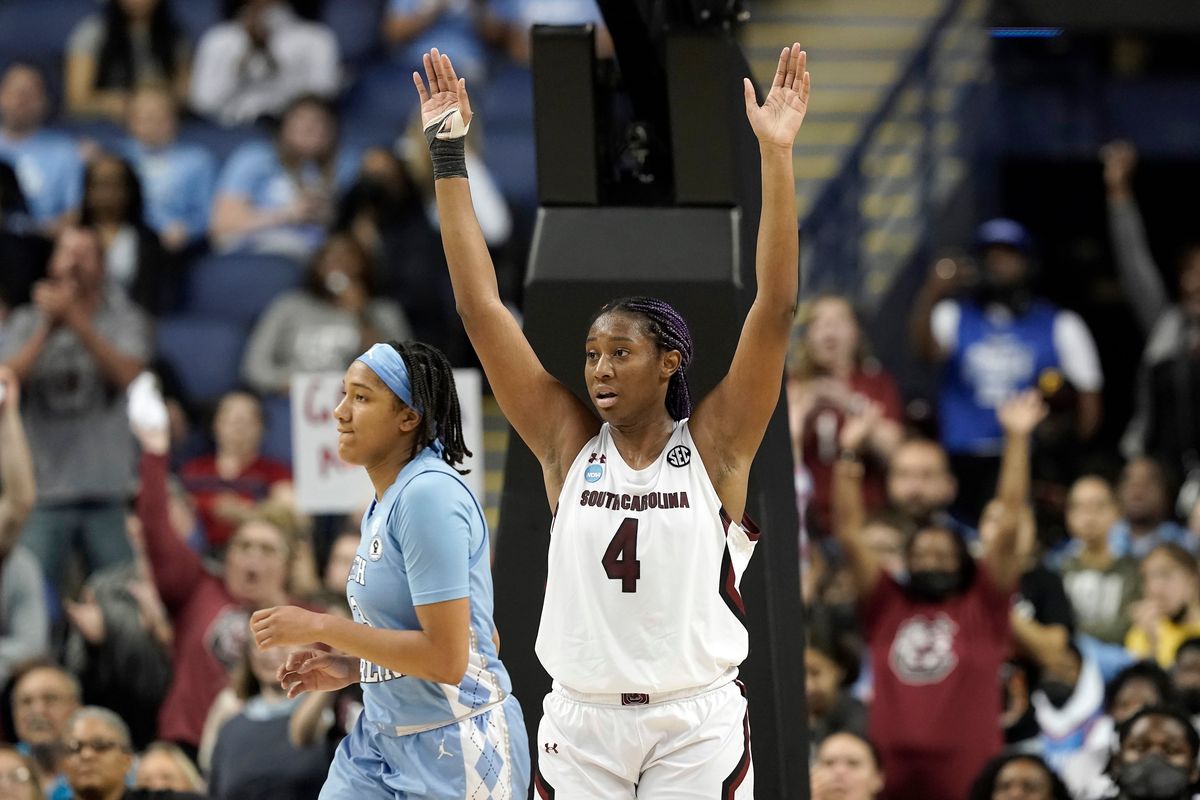 South Carolina forward Aliyah Boston (4) reacts while North Carolina guard Kennedy Todd-Williams, left, looks away following a college basketball game in the Sweet 16 round of the NCAA tournament in Greensboro, N.C., Friday, March 25, 2022.  (Gerry Broome)