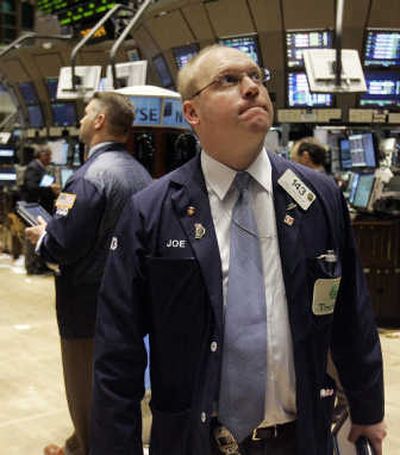 
Trader Joseph Masters watches the boards on the floor of the  New York Stock Exchange on Friday. The Federal Reserve tried to steady markets by injecting $38 billion into the banking system during the day. Associated Press
 (Associated Press / The Spokesman-Review)