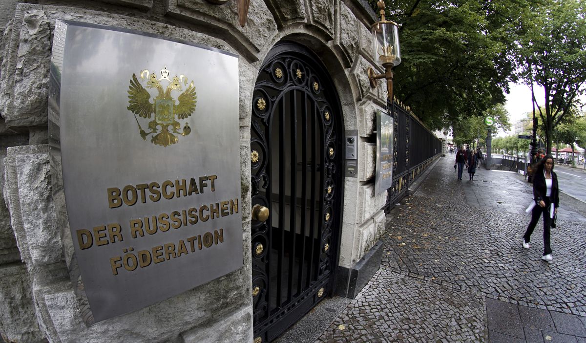 People walk past an entrance of the Russian embassy in Berlin, Germany, Friday, Sept. 4, 2020. Russian President Vladimir Putin