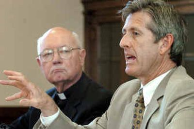 
At a press conference Friday, attorney Shaun Cross and Bishop William Skylstad talk about recent developments in the diocese's bankruptcy case. 
 (Joe Barrentine / The Spokesman-Review)