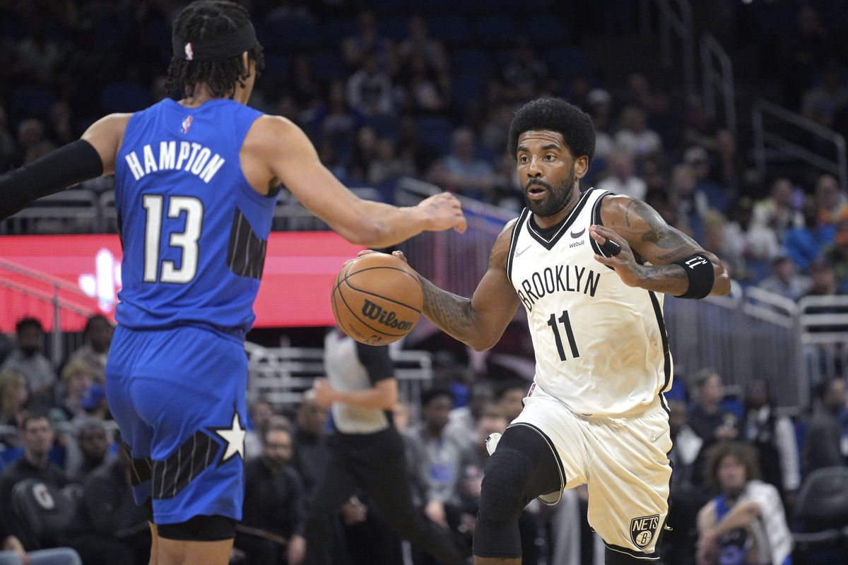 FILE - Brooklyn Nets guard Kyrie Irving (11), who is not permitted to play games in New York because he