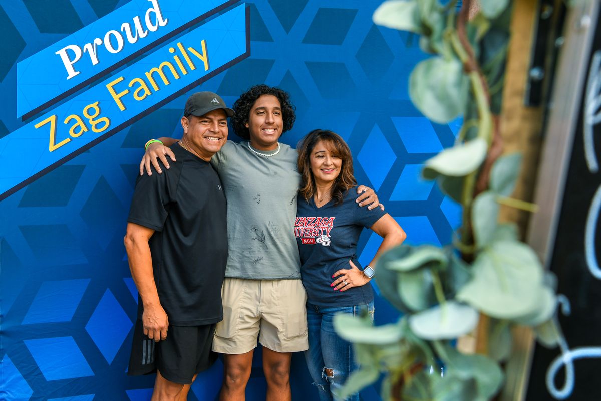 First-year Gonzaga University student Andre Escobar, center, along his parents Edgar, left, and Norma, were all smiles as they visit the photo booth in front of the Foley Library during orientation and move-in day at the residence halls , Friday, Aug. 27, 2021 in Spokane. Some 1330 first-years students are expected .to start the new year.  (DAN PELLE/THE SPOKESMAN-REVIEW)