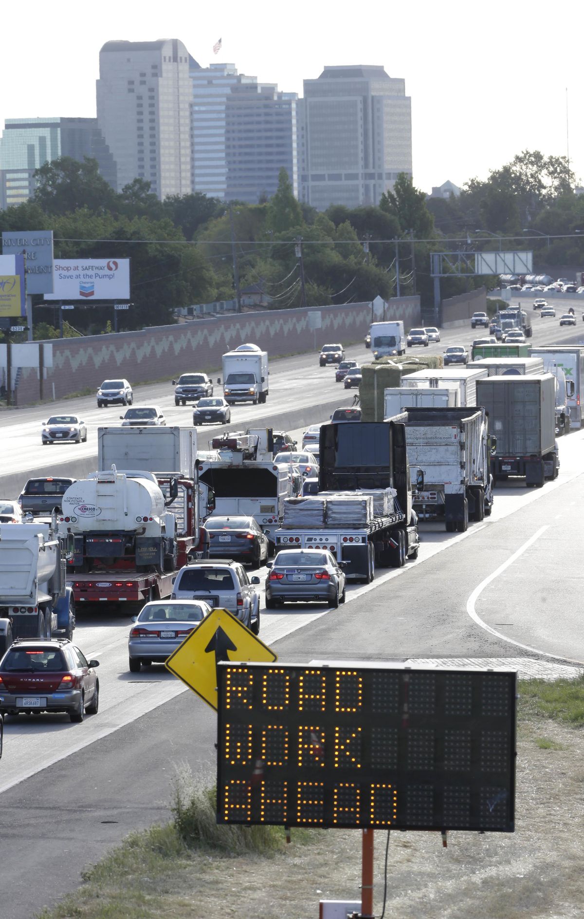 In this April 22, 2014,  photo, highway repair work causes drivers entering Sacramento on  Highway 50 to come to a near standstill as traffic backs up in West Sacramento, Calif. Improving the nation’s roads and bridges would require $120 billion a year through 2020, according to a recent U.S. Department of Transportation estimate. But annual spending at all levels of government is just $88 billion. And the nation’s mass transit systems have over a $90 billion backlog of maintenance and repair needs. (Rich Pedroncelli / File/Associated Press)