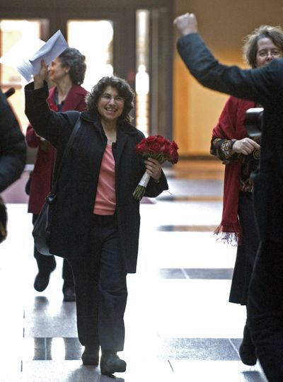 Robin Levine-Ritterman waves her marriage license at City Hall in New Haven, Conn., on Wednesday.  (Associated Press / The Spokesman-Review)
