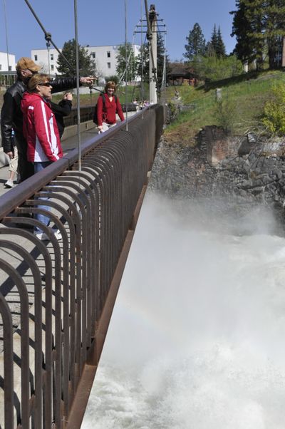 The upper Spokane Falls at Riverfront Park is attracting onlookers with the high water and sunny weather this week. (Mike Prager)