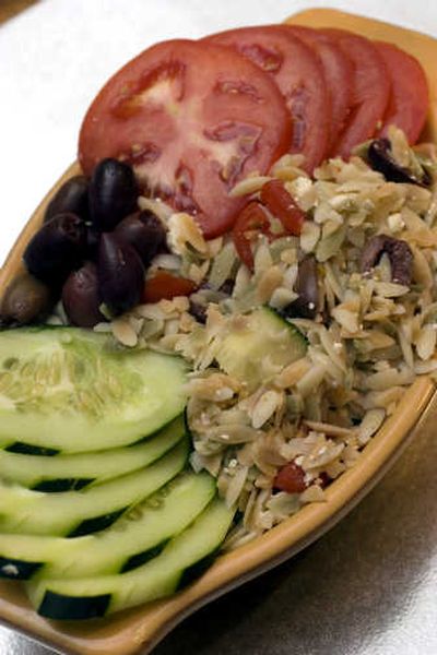 
A delicious and attractive salad, Mediterranean Orzo Salad, fits in well with a meal from the grill. For a dressing, use squeeze bottles of lemon juice.Associated Press
 (Associated Press / The Spokesman-Review)