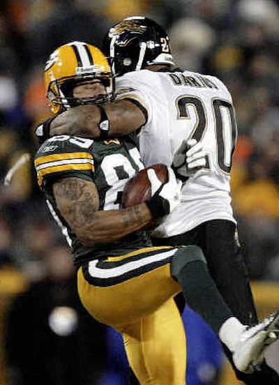
Green Bay's Robert Ferguson was knocked out on this hit by Jacksonville safety Donovin Darius and was hospitalized, but is expected to be OK.
 (Associated Press / The Spokesman-Review)