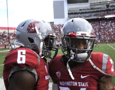 Washington State defensive backs Damante Horton (6) and Theron West (24) laugh after Horton (6) snagged an interception against Southern Utah and returned it for a touchdown during the first half Saturday's game in Pullman.
 (Tyler Tjomsland / The Spokesman-Review)