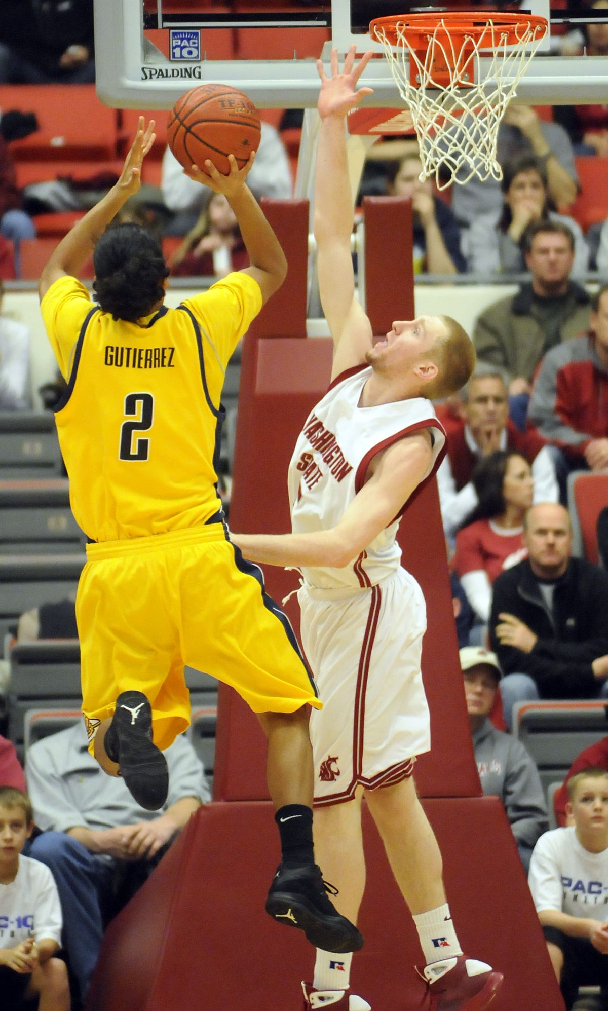Abe Lodwick, right, of the Cougars forces a missed shot by Cal’s Jorge Gutierrez.   (Jesse Tinsley / The Spokesman-Review)
