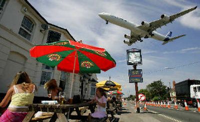 
An Airbus A340-600 flies over The Swan pub as it comes in to land after taking part in a flying display at the Farnborough International Airshow on Monday. 
 (Associated Press / The Spokesman-Review)