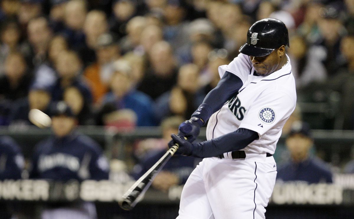 Ken Griffey Jr. connects in fifth for 400th home run as a member of the Mariners and 613th of his major league career.  (Associated Press / The Spokesman-Review)