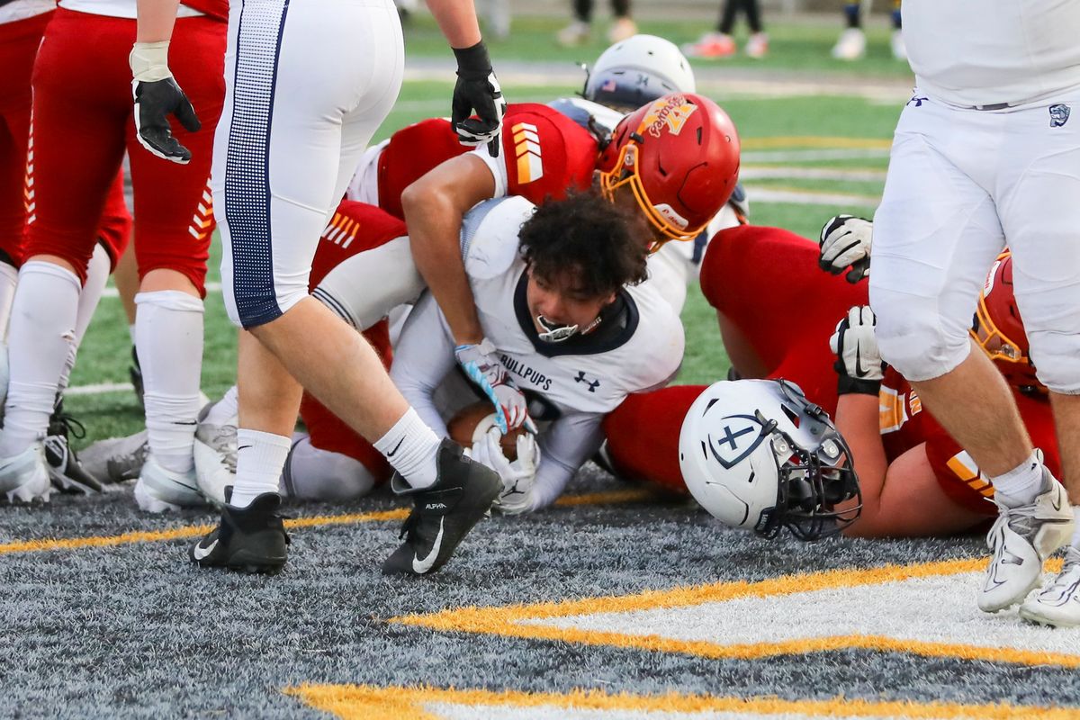 Gonzaga Prep fullback Lilomaiava Mikaele scores on a 3-yard touchdown run to put the Bullpups up 34-20 in the fourth quarter against Kamiakin in a State 4A first-round game in Kennewick. G-Prep won 40-27.  (CHERYL NICHOLS/For The Spokesman-Review)