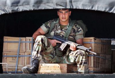 
A Lebanese soldier guards ammunition in a truck headed toward Nahr el-Bared refugee camp  on Saturday. 
 (Associated Press / The Spokesman-Review)