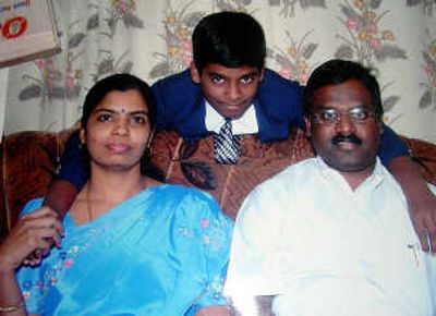 
Dhileepan Raj, 15, seen here with his father, K. Murugesan, and mother, Gandhimathi, performed a filmed Caesarean section birth in an apparent bid to gain a spot in the Guinness book of records. Associated Press
 (Associated Press / The Spokesman-Review)