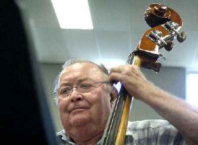 
Bill Gotfredson rehearses on the bass with Tuxedo Junction. 
 (The Spokesman-Review)
