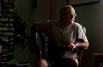 
Gene Rollins listens to the 911 phone calls regarding the rescue efforts for his brother Larry Rollins on June 5. 
 (Kathy Plonka / The Spokesman-Review)