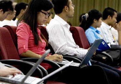 
Chak Sopheap surfs her blog during the Cambodian Bloggers Summit in the capital of Phnom Penh. Many young Cambodians embrace the blog as a medium for socializing and expressing themselves. Associated Press
 (Associated Press / The Spokesman-Review)