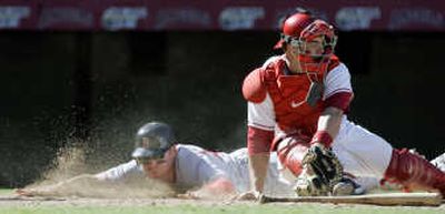 
Associated Press Boston left fielder Jacoby Ellsbury safely slides past Los Angeles catcher Mike Napoli Sunday.
 (Associated Press / The Spokesman-Review)